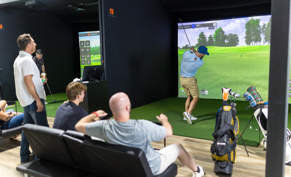 Fairway Golf Simulation facility. Group pf people having fun