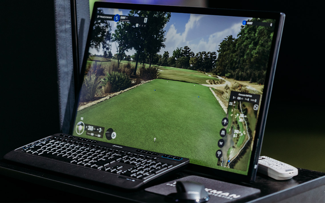 Golf ball on tee at simulator