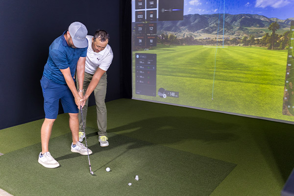 Instructor in Golf Simulator Fairway, San Antonio, Texas.
