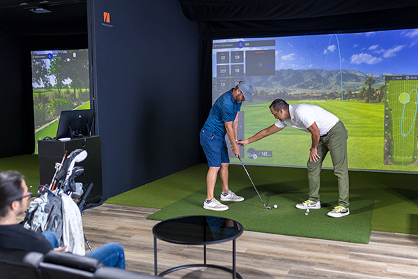 Fairway indoor golf instructor with client