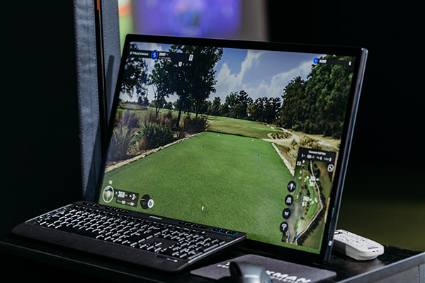 A computer screen featuring a lush golf course, highlighting affordable golf lesson options in San Antonio.