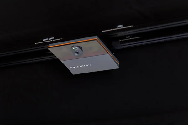 A Trackman installed on the ceiling, used for surveillance and golf tracking purposes