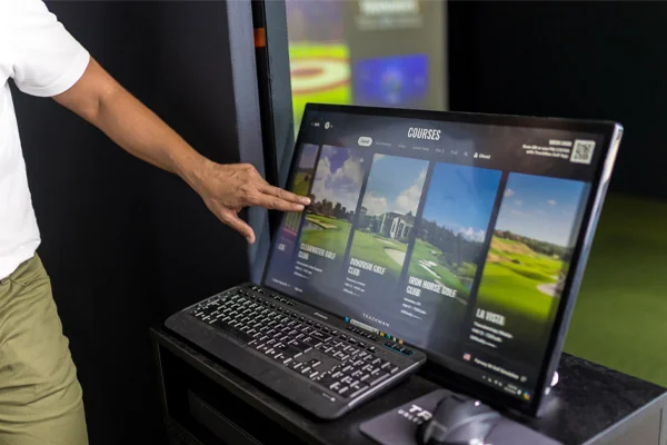 Screen featuring a golf simulation game powered by Trackman.