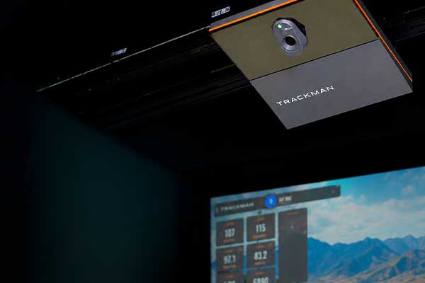A ceiling-mounted trackman in a room, positioned for optimal viewing and presentation purposes.