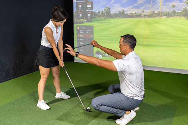 Fairway instructor at indoor golf facility