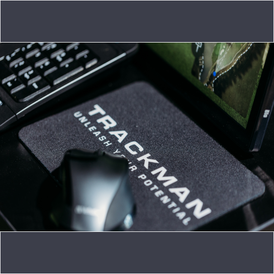 A black mouse pad with the text 