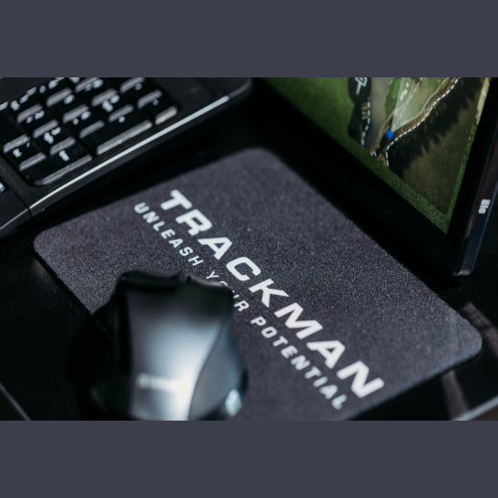 A black mouse pad with the text 